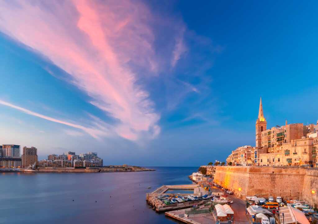 Valletta Skyline with church of Our Lady of Mount Carmel and St. Paul's Anglican Pro-Cathedral, at beautiful sunset, Valletta, Capital city of Malta
